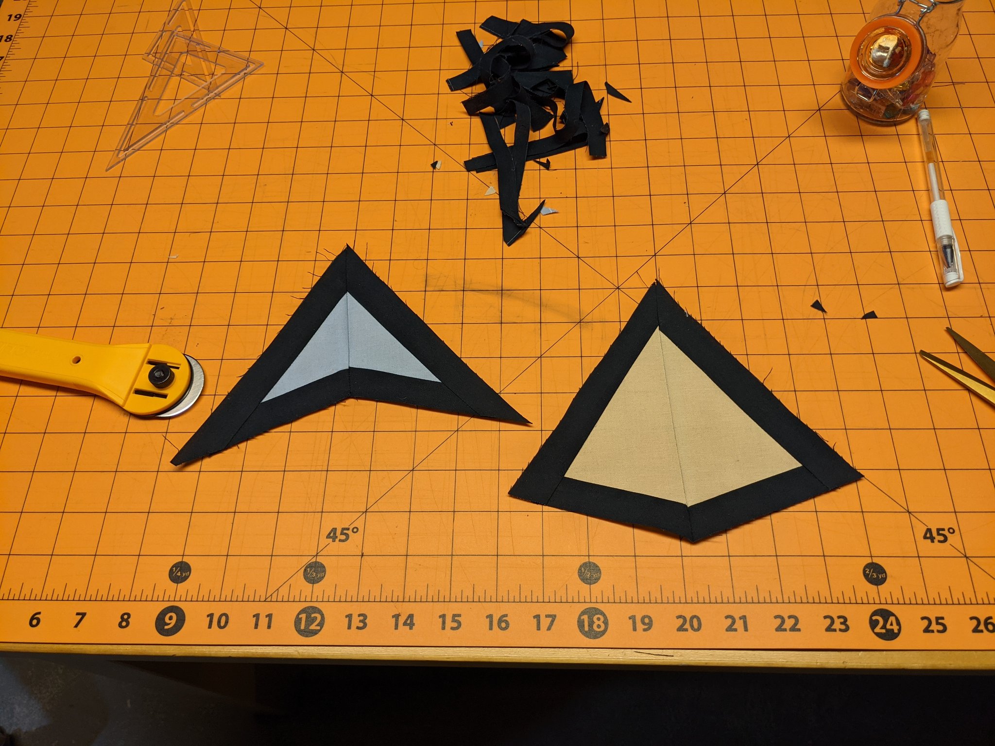 A sewn kite and dart, each with black borders